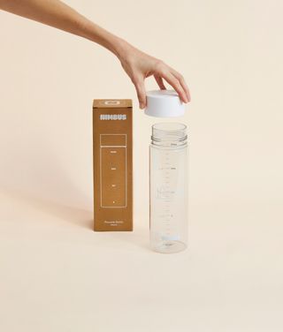 Nimbus Shaker Bottle with lid being lifted off