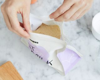 Oat Milk pouch being opened