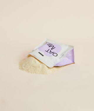 Oat Milk pouch with powder spilling out