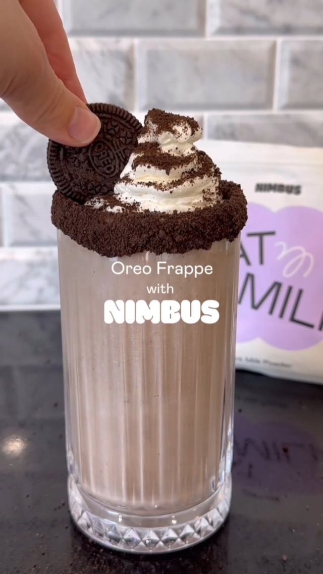 Nimbus Oreo frappe topped with whipped cream and cookie crumbs