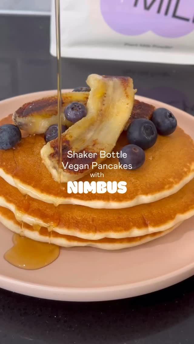 Nimbus shaker bottle pancakes topped with banana, blueberries and syrup